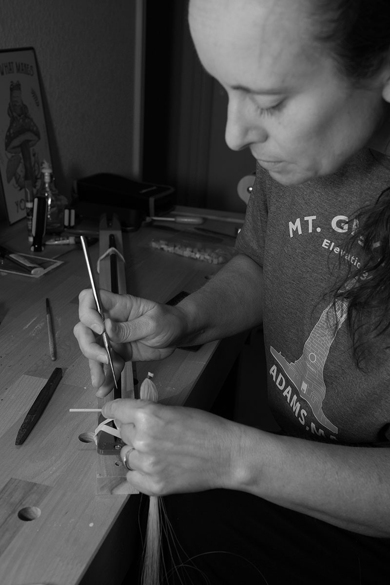 Sarah Harris working at her workbench